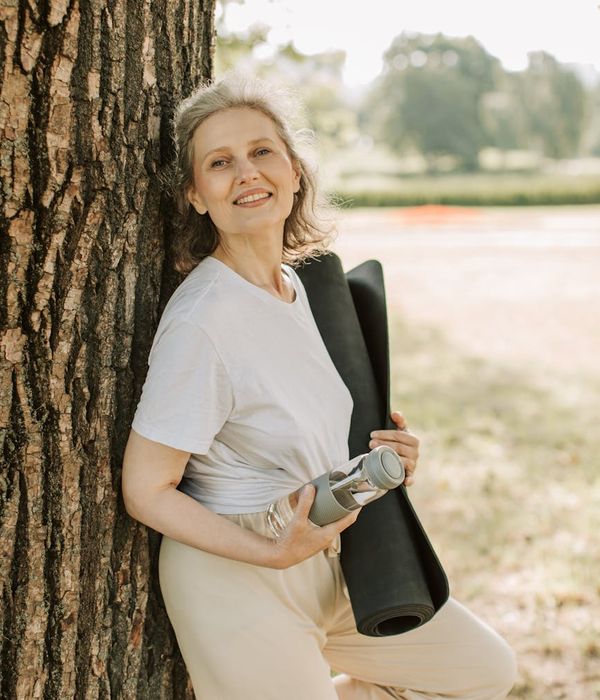 A person smiling peacefully, feeling rested and content.